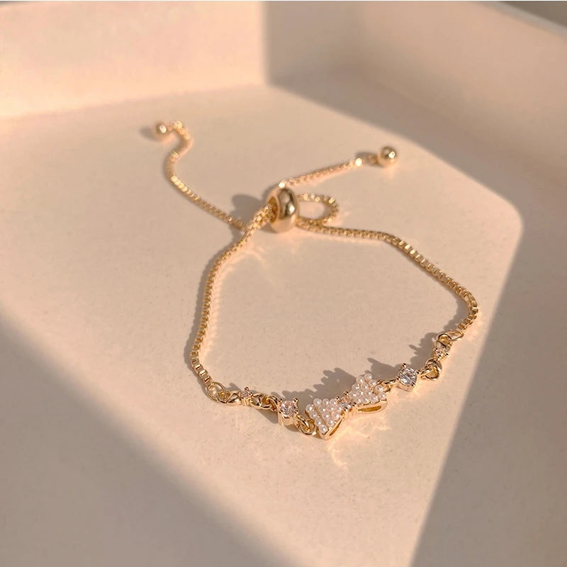 Pulseira Yohi TT de pérolas e camélias ~ de zircônia